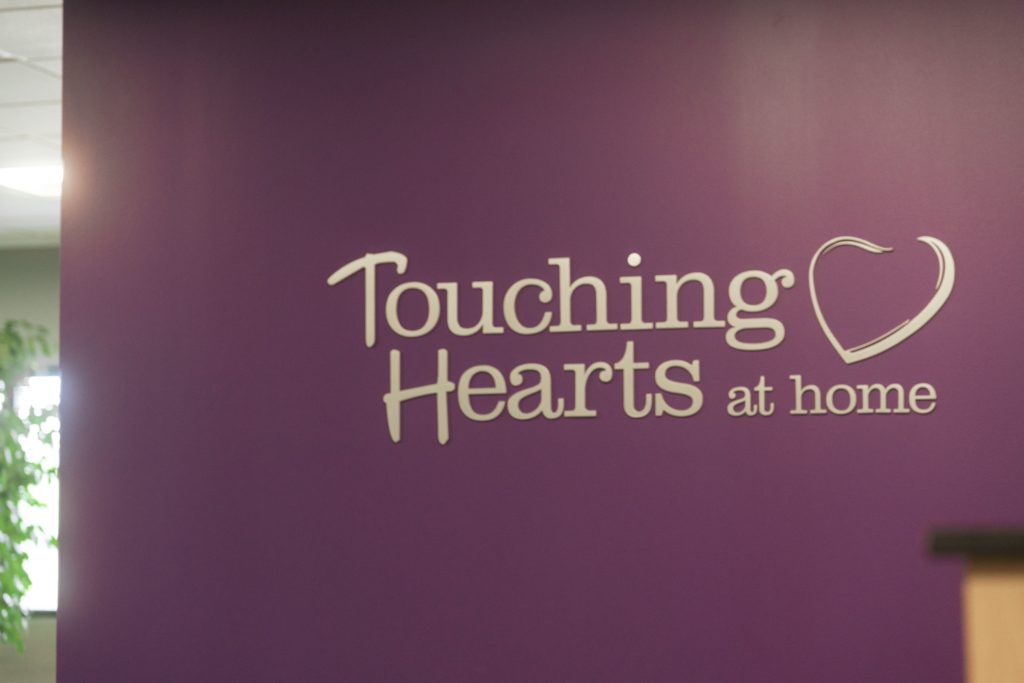 non-medical senior care touching hearts at home logo